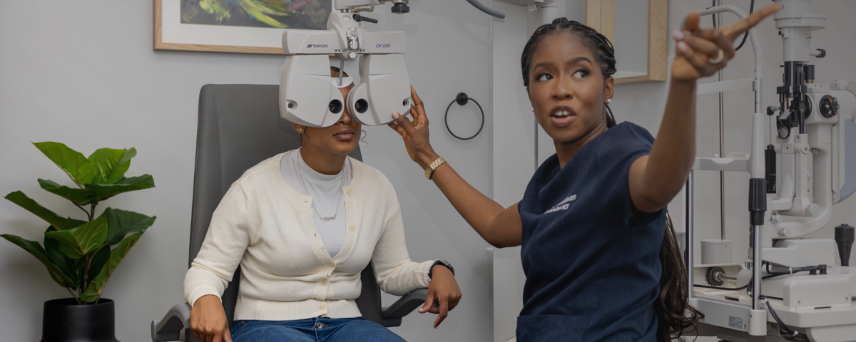 Dr Anesu Madikane conducting an eye examination for a patient before surface laser surgery.